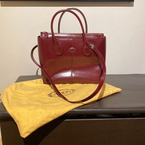 Tod’s Burgundy Handbag with Crossbody Strap.